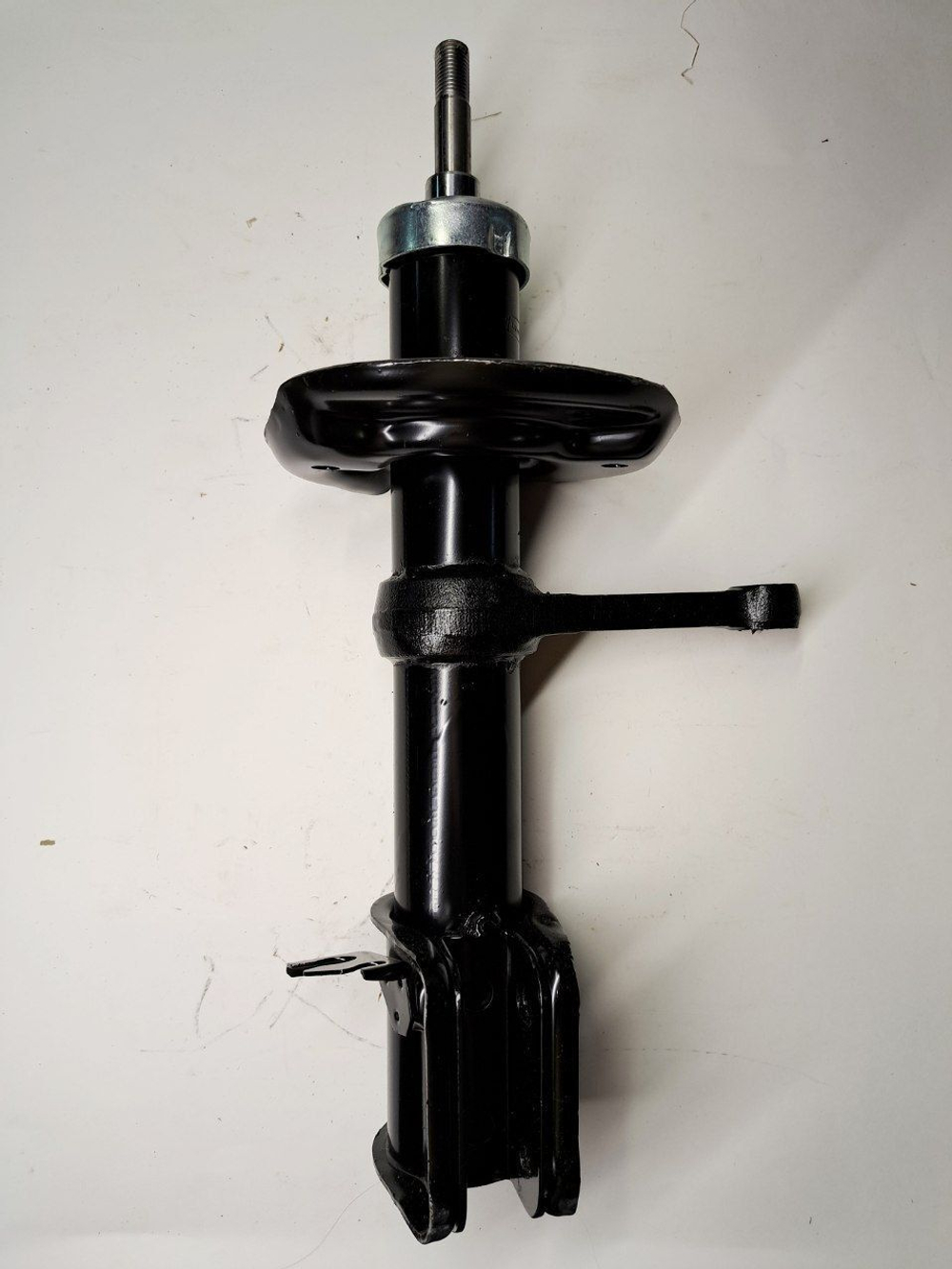 Стойка амортизатора передняя правая 1119-2905402 Птимаш