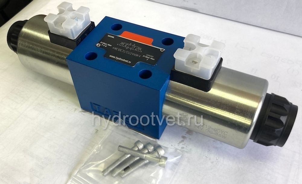 4WE10T31/CG24N9K4 - Гидрораспределитель золотниковый Ду 10 с электроуправлением G24, схема T (64А), возврат - пружинный