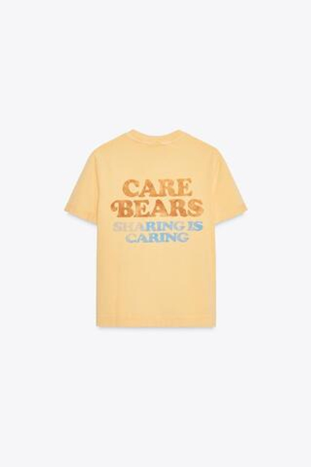 ZARA ФУТБОЛКА С ЭФФЕКТОМ ПОТЕРТОСТИ CARE BEARS™, ЖЕЛТЫЙ