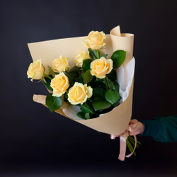 Flower bouquet of 7 Russian creamy roses in package