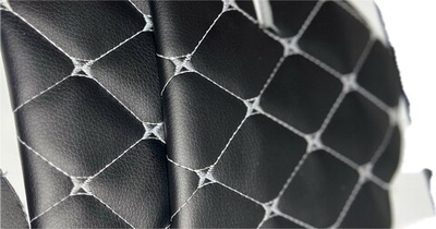 Стёганая чёрная экокожа на поролоне 3 мм. со спанбондом (белая нить Бабочка) 140см. х 50 см.