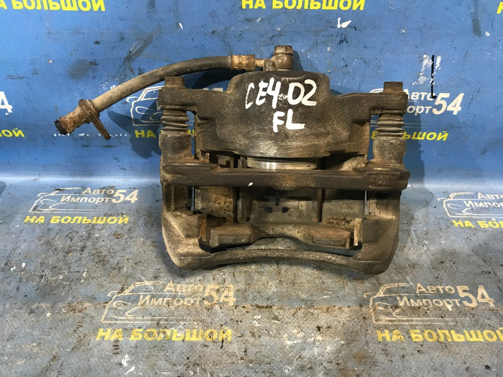 Суппорт тормозной передний левый Honda RAFAGA 1995
