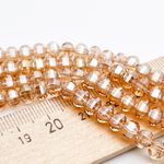 Бусины стекло, цвет золотистый, размер 4,5*6 мм, цена за отрезок 19 см (1/2 нити)