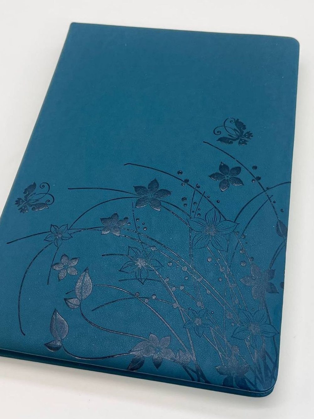 Блокнот 135 л. В5 25*17,5 см лин. т.бирюзовые цветы  (7670-4)