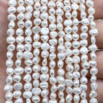 Жемчуг 2А речной бусины 4-5 мм, на нитке 38 см