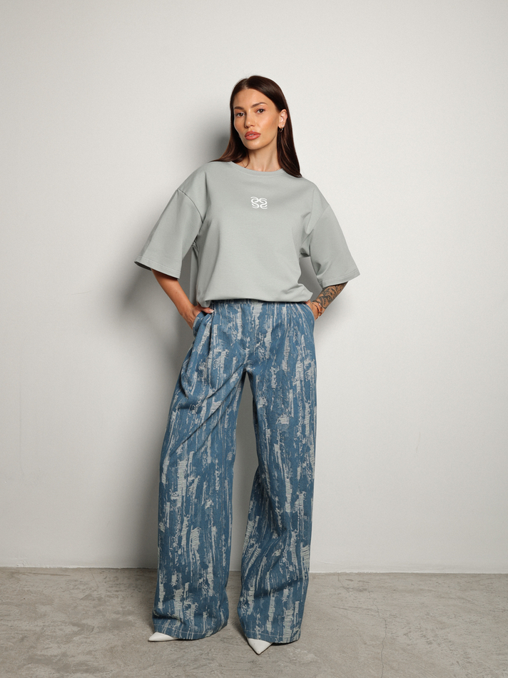 Джинсы с гранжевым эффектом голубые