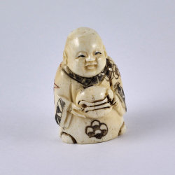 Нэцкэ Ребенок Карако с хлебом