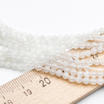 Лунный камень граненый бусины (белая иризация), диаметр около 2,9-3 мм, цена за нить 38 см