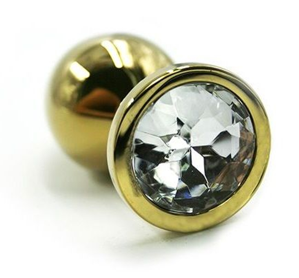 Золотистая алюминиевая анальная пробка с прозрачным кристаллом - 7 см. (Цвет: прозрачный)