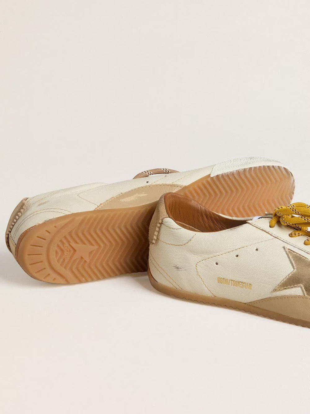 True Star in white nappa leather with gold star and beige suede heel tab