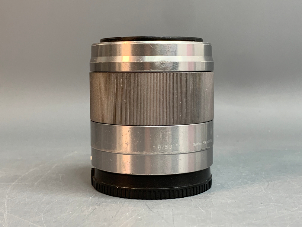 Sony 50mm 1.8 OSS внутри пыль