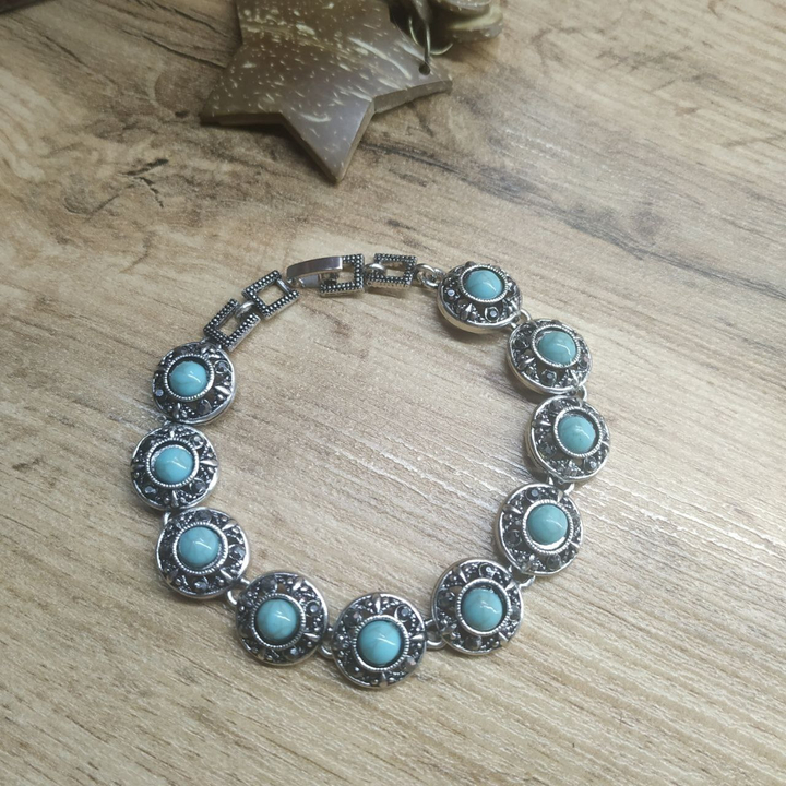 Браслет Vogue Круг бусина под бирюзу стразы графитовые металл серебристый на красном бархате