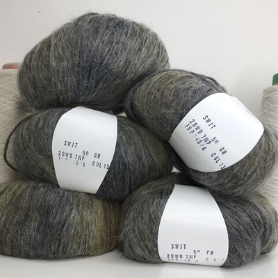 SWJT; 29% меринос, 7% альпака, 45% п/а, 19% п/л;  250м/100гр;  col.13 серый с желтоватыми фрагментами;  Вес моточка 50гр;  Цена за один моток; S926
