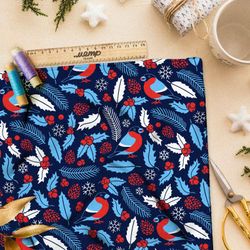 Ткань флис голубые снегири и листья с шишками на синем фоне