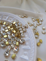 Стразы овальные в цапах золото