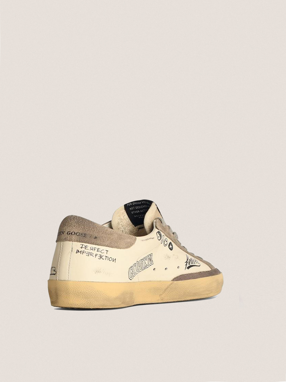 Super Star in white leather with contrasting decorative lettering