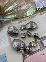 Пуговицы в форме ракушки серебристые