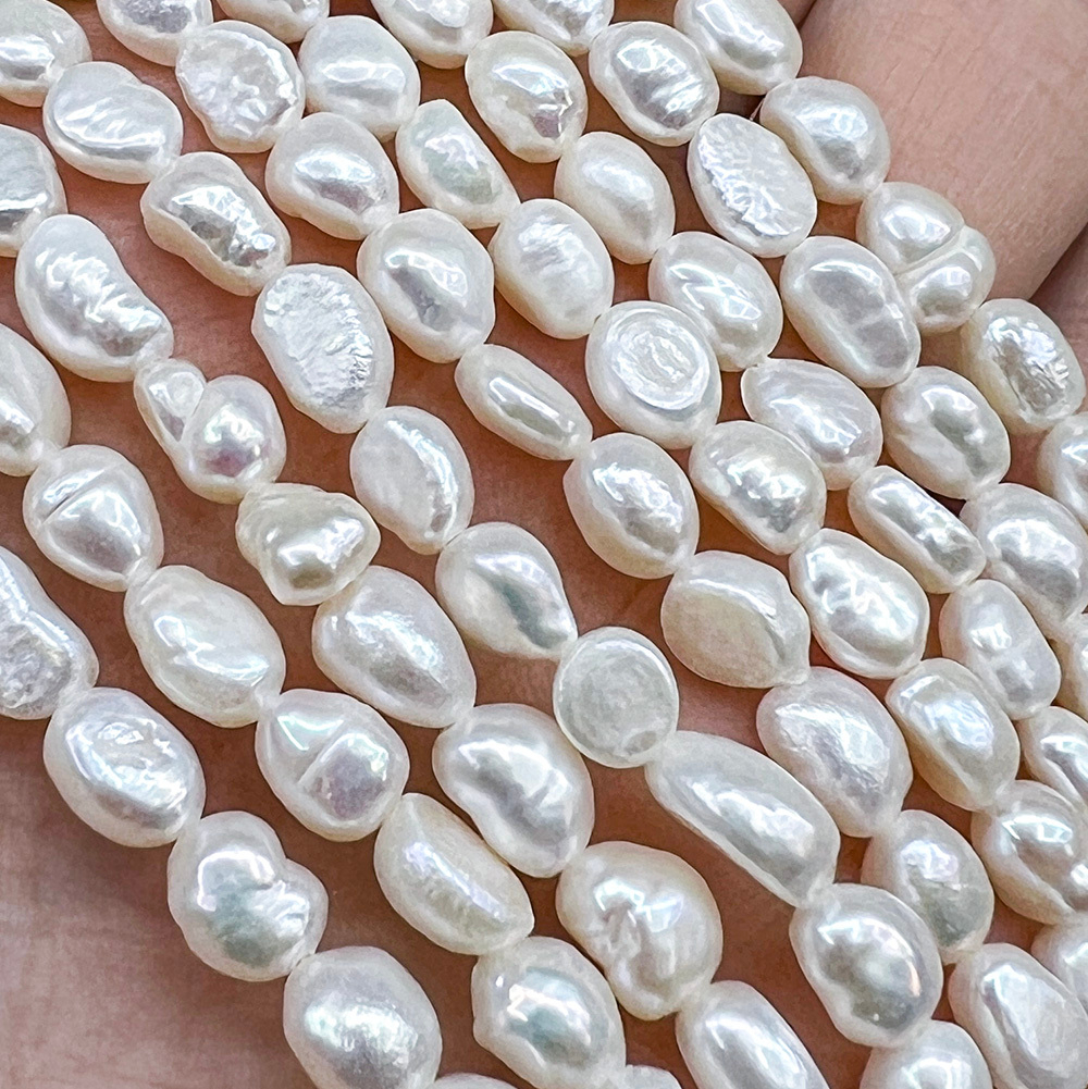 Жемчуг 2А речной бусины 5-6 мм, на нитке 38 см