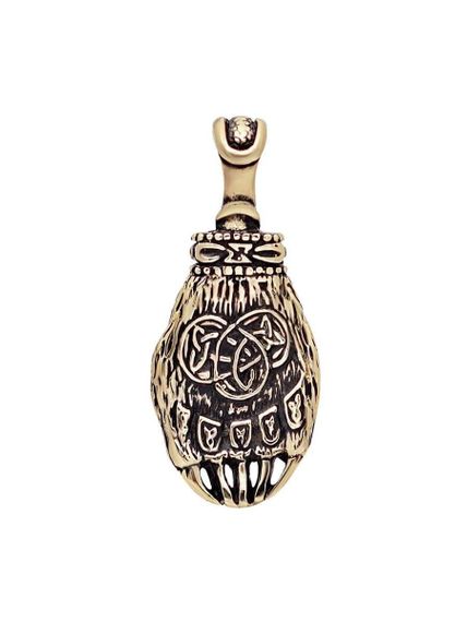 Фото бронзового амулета в виде объемной лапы Велеса, вид в профиль.