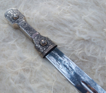 Кинжал кавказский в мельхиоре. Ножны украшаются кавказским орнаментом, выполненным чеканкой и гравировкой