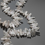 Жемчуг культивированный Бива с боковым центральным отверстием, белый, 18-26*5-8мм