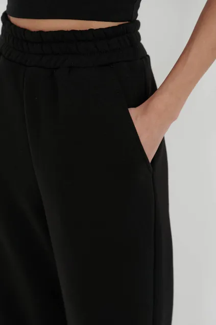 Утепленные брюки клеш черного цвета