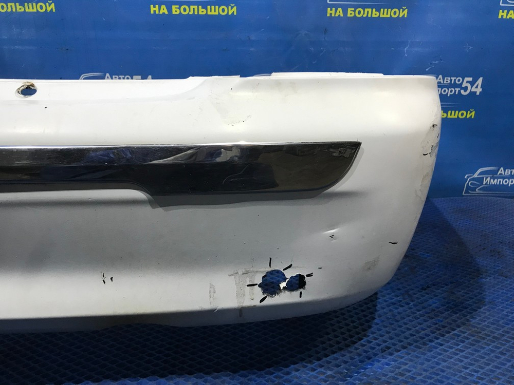 Бампер задний MAZDA FAMILIA 2000