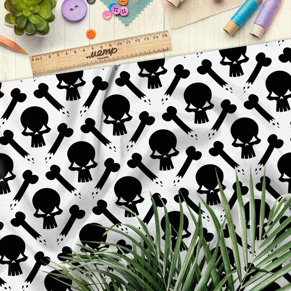 Ткань барби чёрные черепа и кости на бежевом фоне