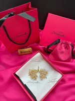 Брошь Schiaparelli