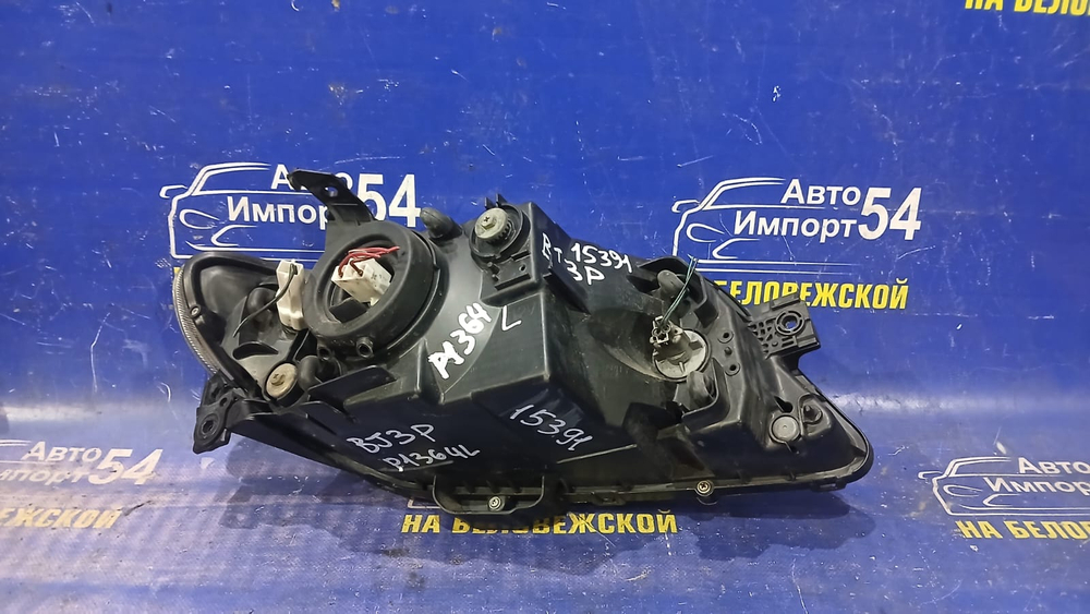 Фара передняя левая MAZDA FAMILIA 2000-2003