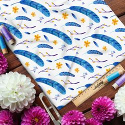 Ткань атлас синие перья и жёлтые цветы на белом фоне