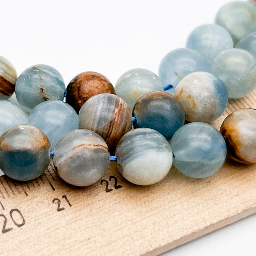 Кальцит бусины, диаметр около 10-10,1 мм, цена за 9 шт (1/4 нити)