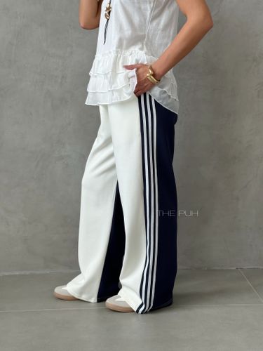 Бело-синие широкие брюки с лампасами