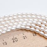 "Майорка" рис, цвет белый, размер около 5*3,5 мм, цена за отрезок 19 см (1/2 нити)