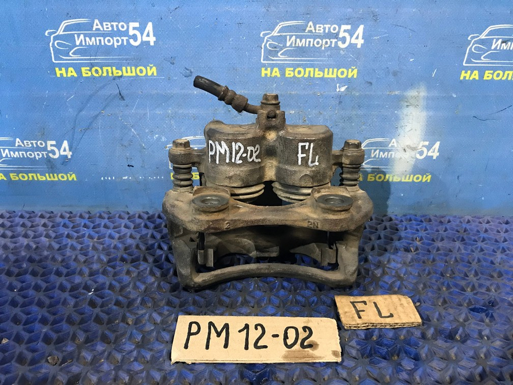 Суппорт тормозной передний левый NISSAN LIBERTY 1999