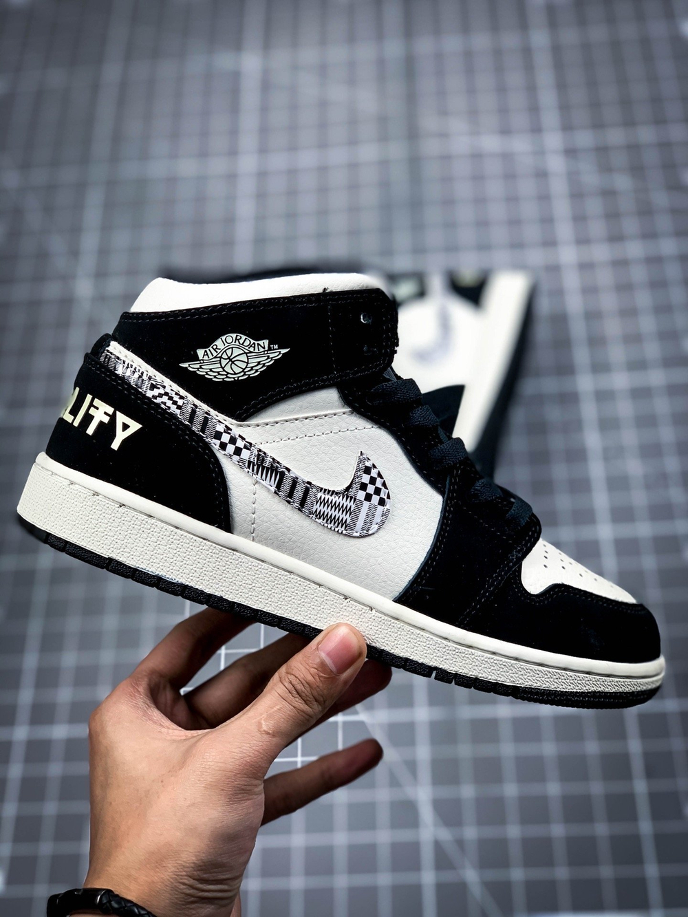 AIR JORDAN 1 MID MELO SE EQUALITY BLACK/BLACK-SAIL-WOLF GREY