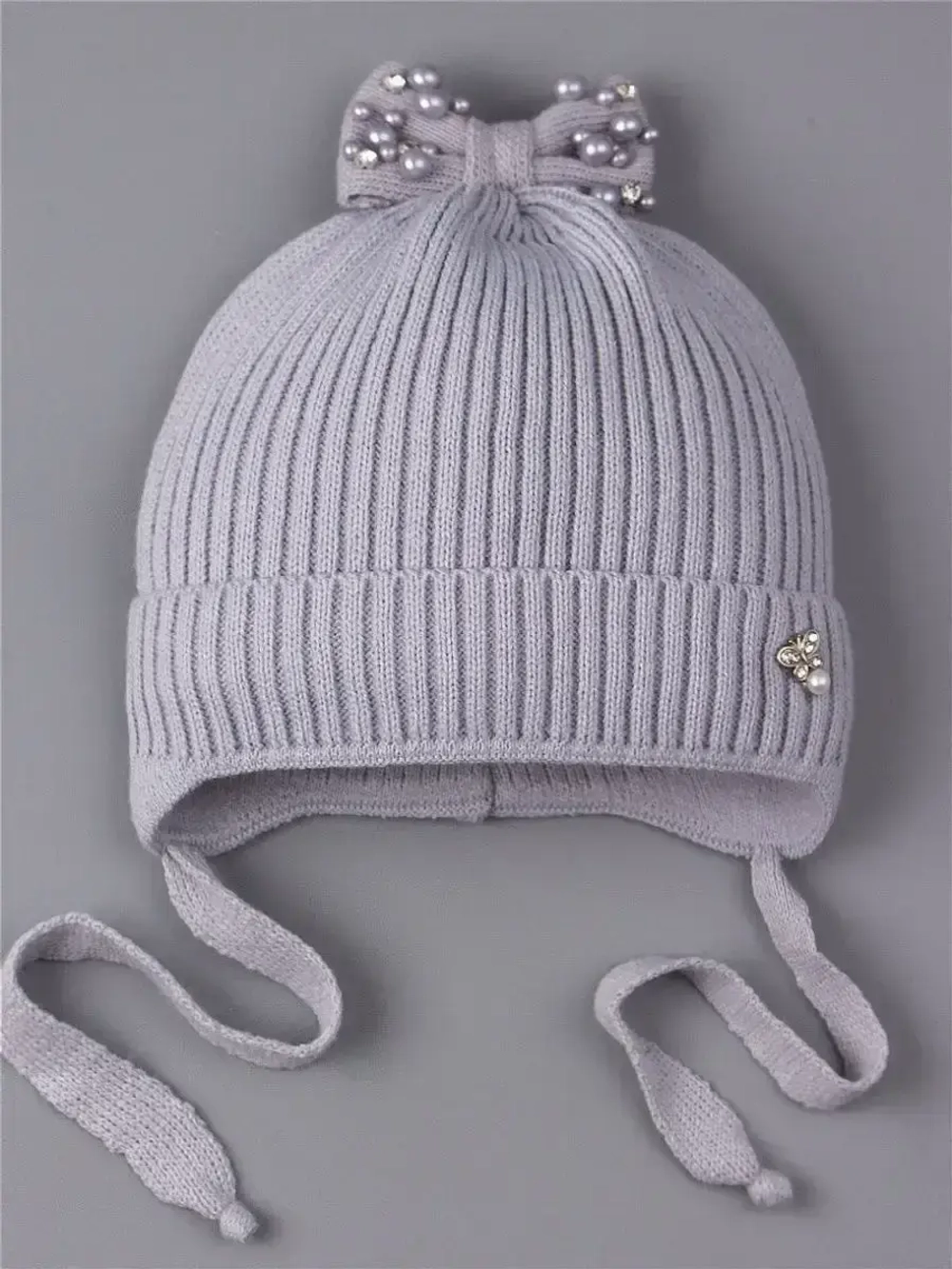 Шапка вязаная демисезонная на завязках
