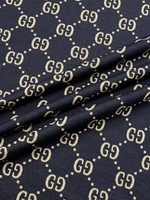 Трикотаж хлопковый Gucci синий с крупным дизайнерским принтом
