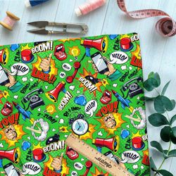 Ткань шифон громкие предметы из комиксов на зелёном фоне