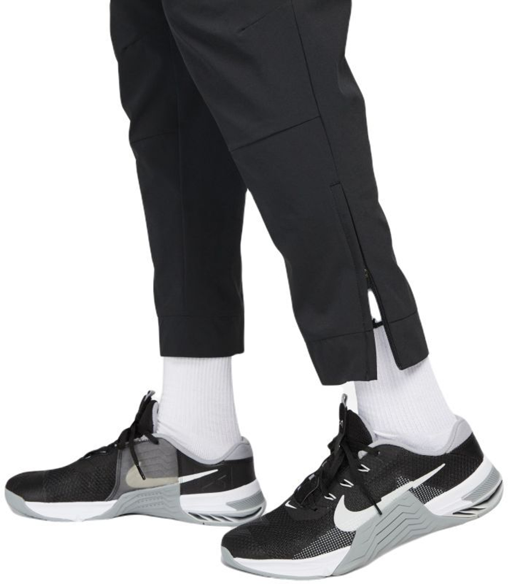 Мужские теннисные штаны Nike Unlimited Dri-Fit Zippered Cuff Versatile - черный