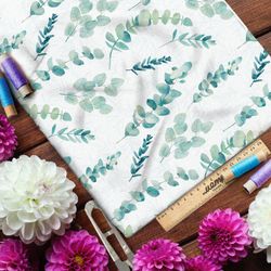 Ткань кулирная гладь акварельные листья на бежевом фоне с узором