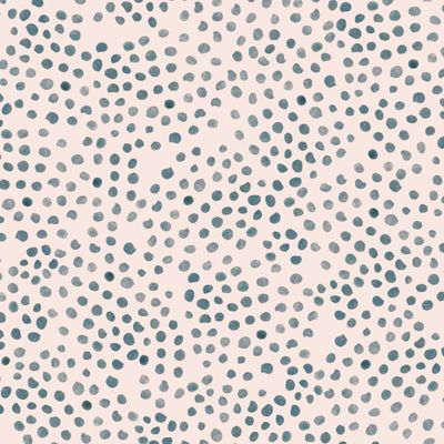 Abstract polka dots on a light pink background