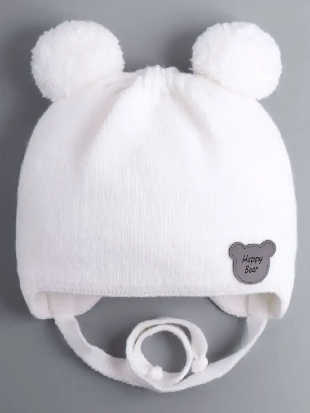 Шапка детская осенняя с завязками и помпонами