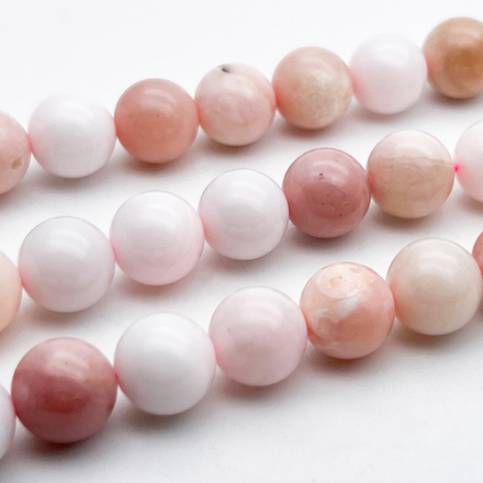 Опал розовый бусины, диаметр около 10,4-10,6 мм, цена за 9 шт (1/4 нити)
