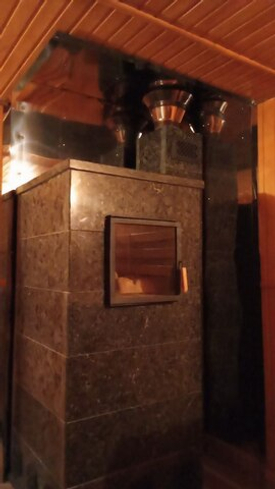 Каменные одежды тепла: почему выбирают банные печи в каменной облицовке