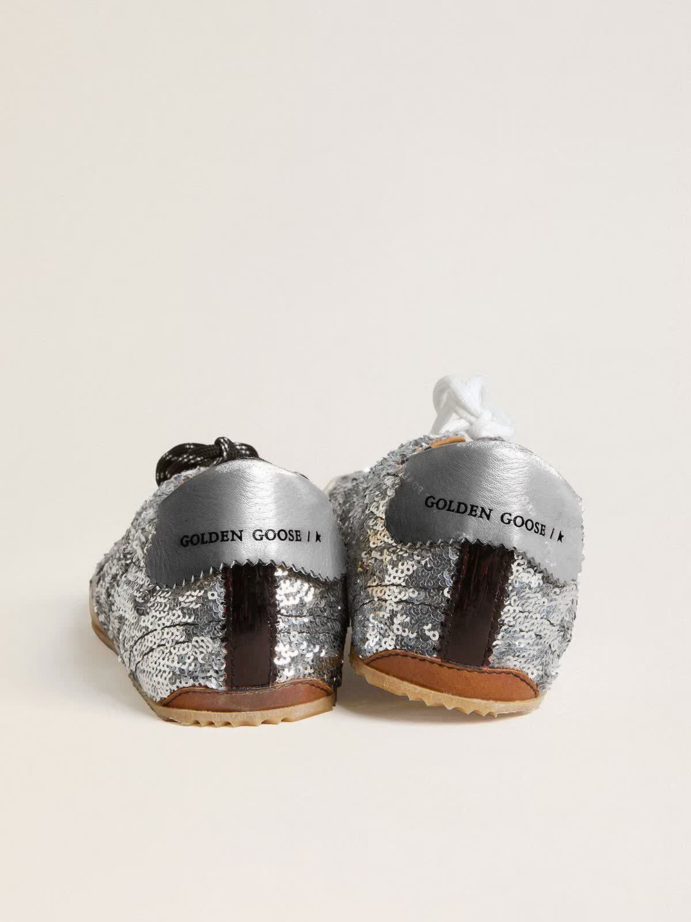 True Star in silver sequins with black star and beige leather heel tab