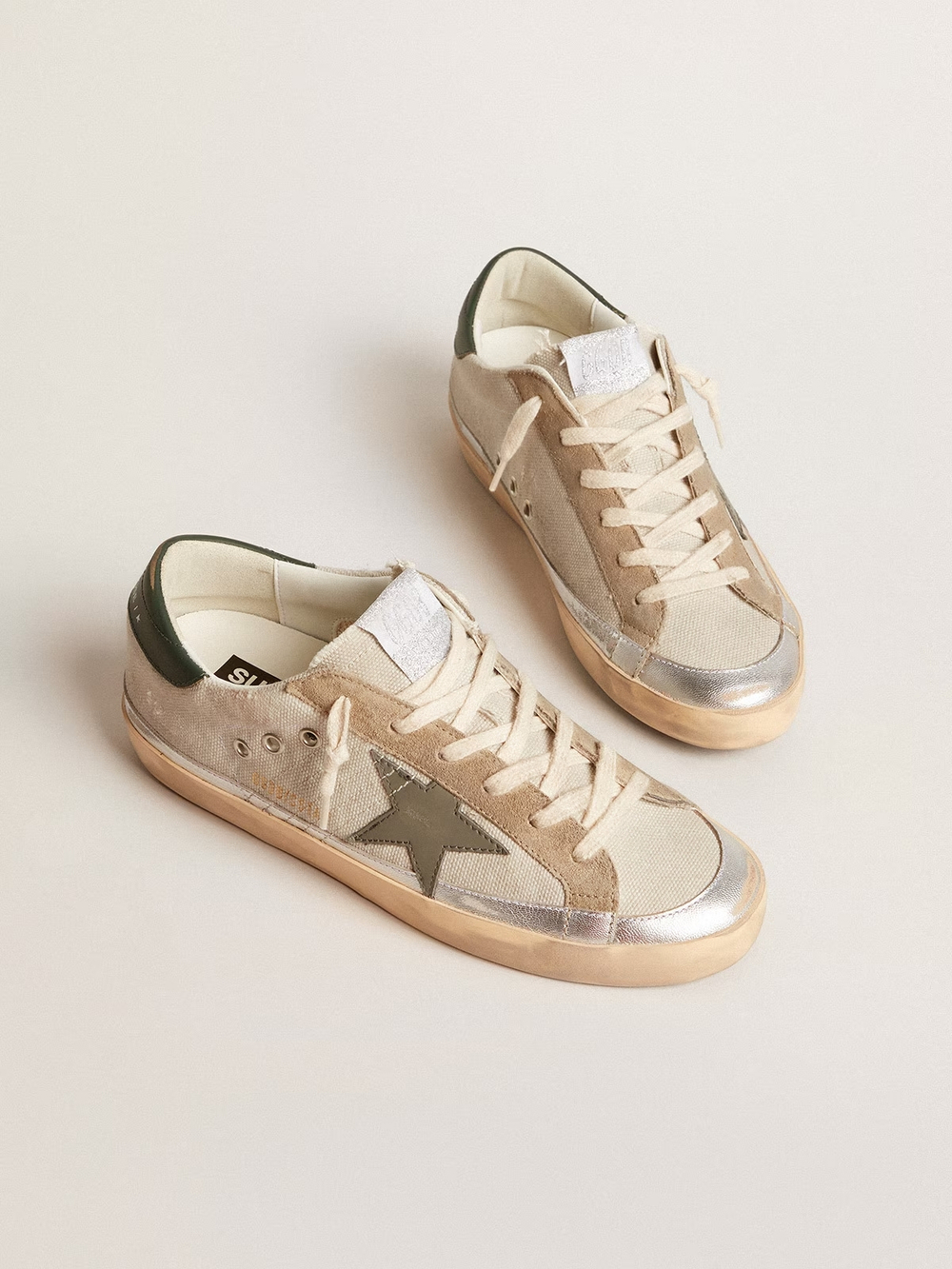 Super Star in gray canvas with a green leather star and heel tab