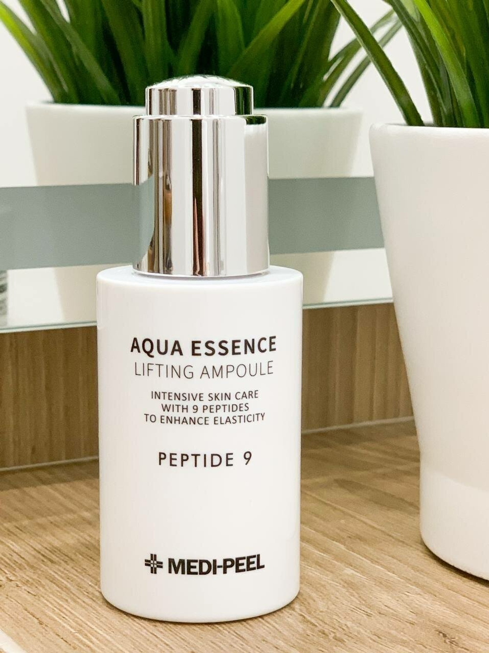 Омолаживающая лифтинг сыворотка с пептидами MEDI-PEEL Peptide 9 Aqua Essence Lifting Ampoule (50 мл.)