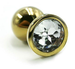 Золотистая алюминиевая анальная пробка с прозрачным кристаллом - 6 см. (Цвет: прозрачный)