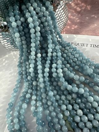 Нить бусин из тонированного кварца 8мм, гладкие